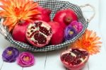 Fresh Pomegranate Fruits Isolated On A White Wooden Background Stock Photo