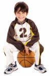 Kid Stylishly Sitting On The Ball Stock Photo