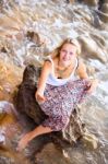 Beautiful Young Blonde Woman Posing Outdoor At The Rocky Sea Sho Stock Photo