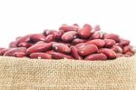 Kidney  Beans In Sacks Fodder On White Background Stock Photo