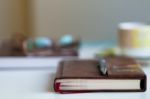 Book On Desk Blurred Background Stock Photo