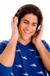 Portrait Of Smiling Man Listening Music Stock Photo