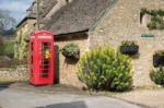 Defibrillator In And Old Phone Box In Upper Slaughter Village Stock Photo