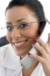 Female Doctor Talking over Phone Stock Photo