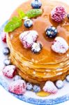 Pile Of Pancakes With Blueberries And Raspberries Sprinkled With Stock Photo