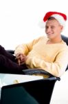 Smiling Male Wearing Christmas Hat Stock Photo