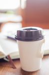 Closed Up Coffee Cup On Wooden Table Stock Photo