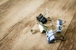 Colorful Paper Clip On Wood Table Stock Photo