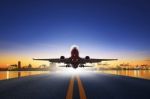 Cargo Plane Take Off From Airport Runways Against Ship Port Back Stock Photo