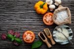 The Ingredients For Homemade Pizza On Shabby Wooden Background Stock Photo