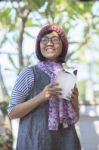 Asian Woman Holding Open Booket Book In Hand And Toothy Smiling Face Happiness Emotion Stock Photo