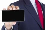 Smartphone On Businessman Hand Stock Photo