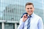 Businessman Standing Outside Modern Building Stock Photo