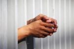 Hand In Jail Stock Photo