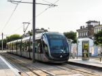 Tram Passing Through Bordeaux Stock Photo