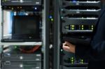 People Fix Server Network In Data Room Stock Photo