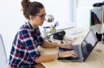 Young Businesswoman Working In Her Office With Laptop Stock Photo