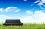 Sofa On The Grass Field   Stock Photo