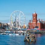 Cardiff/uk - August 27 : Ferris Wheel And Pierhead Building In C Stock Photo