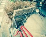 Retro Bicycle With Flower In The Basket Stock Photo