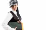 Female Student Wearing Cap Holding Books Stock Photo