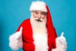 Happy Santa Claus Gesturing Thumbsup Stock Photo