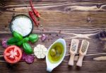 The Ingredients For Homemade Pizza On Shabby Wooden Background Stock Photo