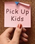 Pick Up Kids With Post It Note Stock Photo