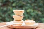 Mini Pies On Wooden Plate Stock Photo