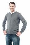 Smiling Man With Hands On Hips Stock Photo