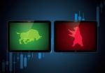 Stock Market Bull Bear Candle Stick Tablet Stock Photo