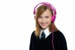 Cute Teenager Listening To Music Through Headphones Stock Photo