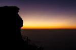 Sunrise And Sea Of Fog At Phu Chi Fa In Early Morning (silhouette) And Tourists At Tip Of Hill. Thailand Stock Photo