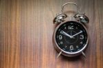 Alarm Clock On Wooden Background Stock Photo