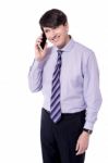 Businessman Talking On Smart Phone Stock Photo