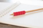 Blank Notebook With Pencil On Grey Background Stock Photo