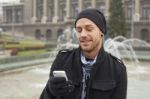 Man With Mobile Phone In Hands Stock Photo