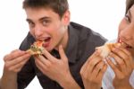 Teenage Couple Eating Pizza Stock Photo