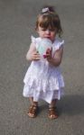 Baby Girl Sipping From A Cup Stock Photo