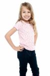 Cheerful Girl Child With Hands On Waist Stock Photo