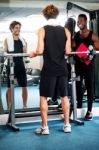 Smart Young Guy Lifting Barbells In Gym Stock Photo