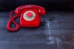 Retro Vintage Red Landline Unhang On Wooden Background Stock Photo