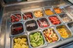 Various Fresh Fruit And Vegetable Salad Bar Healthy Items Stock Photo