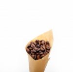 Espresso Coffee Beans On A Paper Cone Stock Photo