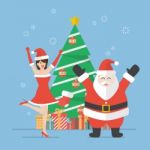 Santa Claus And Santa Woman With Christmas Tree Stock Photo