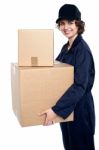 Friendly Delivery Woman In Uniform Stock Photo