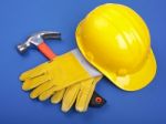 Hard Hat Hammer And Leather Gloves Stock Photo