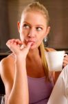 Woman At Home Having Breakfast Stock Photo