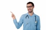 Smiling Doctor Pointing Copy Space Area Stock Photo