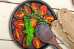 Baked Cherry Tomatoes With Basil And Thyme Stock Photo